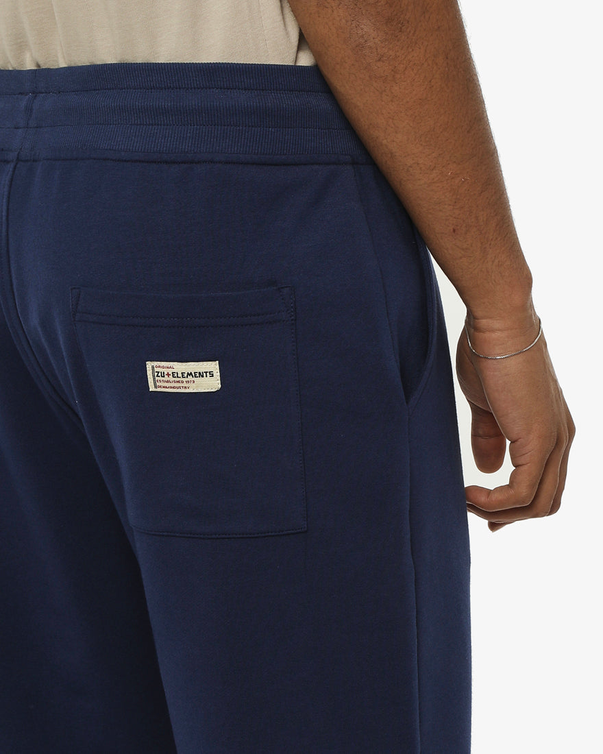 Pantaloni felpa con logo ricamato sul davanti, vita e fondo a coste