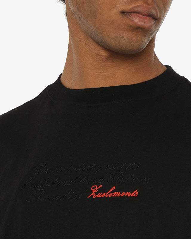 T-shirt girocollo maniche corte relaxed fit con taglio spalla e ricamo frontale