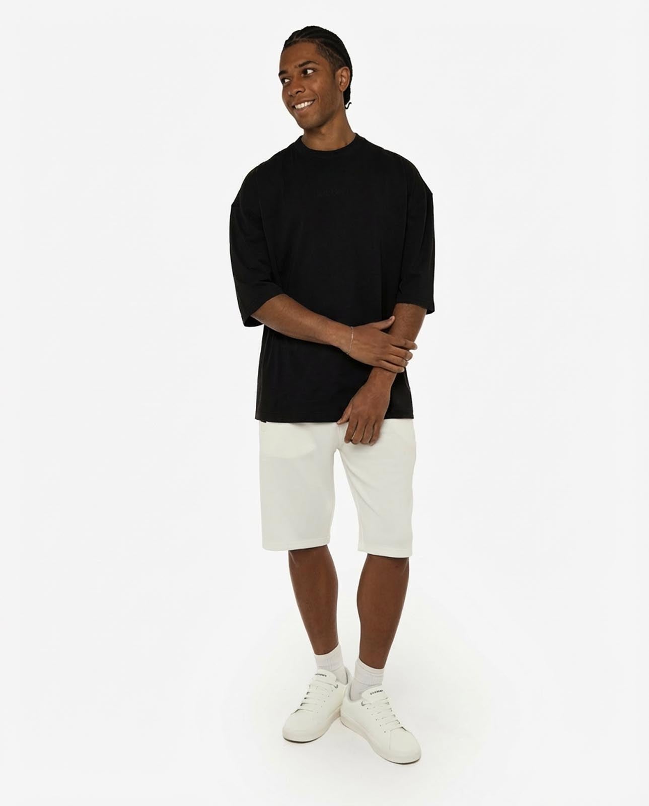 T-shirt girocollo maniche corte relaxed fit, taglio spalla e stampa frontale