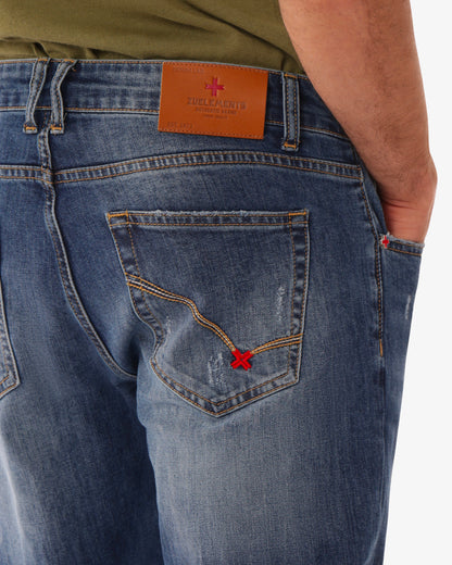 Jeans slim fit blu medio con accessori logati