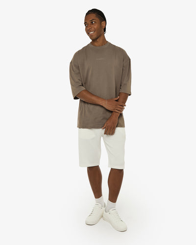 T-shirt girocollo maniche corte relaxed fit, taglio spalla e stampa frontale