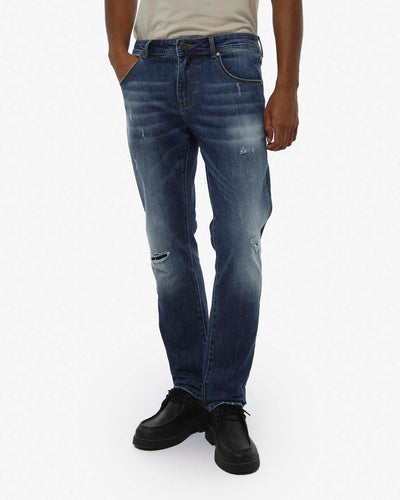 Jeans slim fit in tono medium blue con piccoli strappi