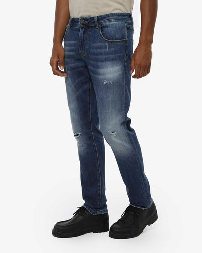 Jeans slim fit in tono medium blue con piccoli strappi