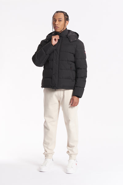 Jacket with hood, zip and button fastening