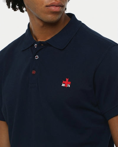 Polo piquet in puro cotone con logo ricamato e bottoni logati