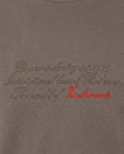 T-shirt girocollo maniche corte relaxed fit con taglio spalla e ricamo frontale